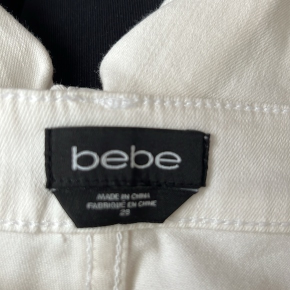 White stretchy Bebe jeans size 28.like new.Zippers on the bottom. - Picture 5 of 8